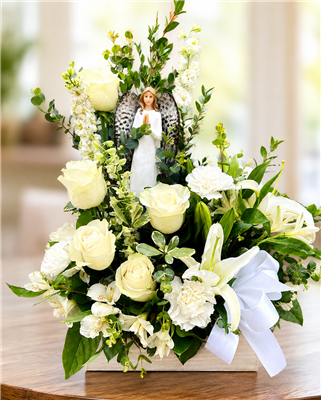 Heavenly Light white sympathy flower arrangement with roses, lilies, snapdragons, alstroemeria, greenery, and an angel keepsake