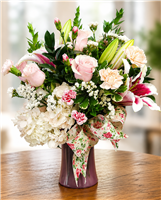 Blushing Beauty Bouquet with pink roses white hydrangea stargazer lilies pink carnations and white filler flowers arranged in a keepsake vase