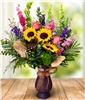 Golden Hour Garden luxury floral arrangement with sunflowers, pink roses, purple larkspur, bells of Ireland, eucalyptus, and lush greenery