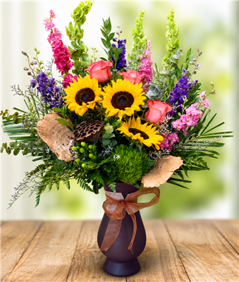 Golden Hour Garden luxury floral arrangement with sunflowers, pink roses, purple larkspur, bells of Ireland, eucalyptus, and lush greenery