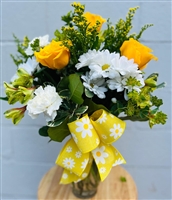 Bouquet with white daisies, yellow roses, carnations, and greenery finished with a yellow daisy-print bow.