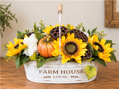 Artificial fall sunflower arrangement with pumpkins and lotus pods in Farm House Local container