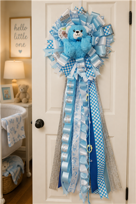Blue and white baby boy door mum with teddy bear and layered ribbon