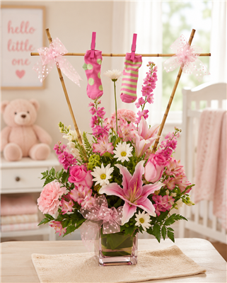 Pink new baby girl flower arrangement with roses, stargazer lilies, carnations, daisies and keepsake baby booties