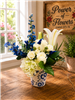 Blue and white bouquet with roses hydrangea lilies and delphinium in a ceramic Delft style vase