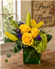 Yellow rose and lily flower arrangement with green hydrangea and purple statice