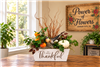 So Very Thankful fall Thanksgiving centerpiece with seasonal greenery and autumn accents in a keepsake container