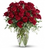 Forever Beloved arrangement with 30 long-stem roses and eucalyptus in a clear glass vase