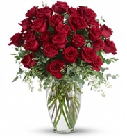 Forever Beloved arrangement with 30 long-stem roses and eucalyptus in a clear glass vase