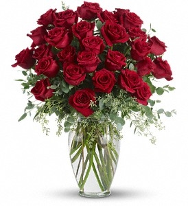 Forever Beloved arrangement with 30 long-stem roses and eucalyptus in a clear glass vase