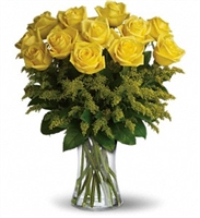 Yellow rose bouquet with solidago and greenery in a glass vase friendship arrangement