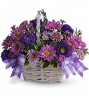Lavender and purple basket arrangement with chrysanthemums and asters in a white bamboo basket