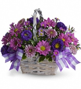 Lavender and purple basket arrangement with chrysanthemums and asters in a white bamboo basket