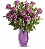 Simply Exquisite Lavender Rose Bouquet with lavender roses and waxflower in a purple glass vase