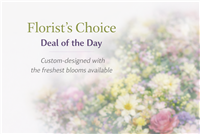 Custom florist choice bouquet with seasonal flowers and greenery in a vase arrangement