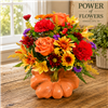 Autumn bouquet with orange roses, red carnations, bronze poms, alstroemeria, and berries arranged in a ceramic pumpkin container.