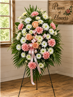 Pink and white funeral standing spray with peach roses, pink carnations and white chrysanthemums