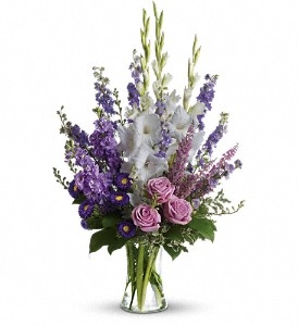 Tall lavender and white bouquet with larkspur, roses, asters, and pink heather in a one-sided design – League City flower delivery