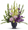 Lavender and green gladioli tribute bouquet with purple carnations in a timeless urn, one-sided design
Sympathy floral arrangement with green gladioli, lavender stock, and carnations for memorial service.