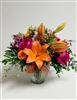 Bright and Beautiful bouquet with hot pink roses, lilies, alstroemeria, and spray roses in a clear glass vase
