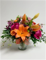 Bright and Beautiful bouquet with hot pink roses, lilies, alstroemeria, and spray roses in a clear glass vase