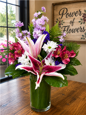 Stargazer lily and lavender stock flower arrangement with daisies and pink alstroemeria