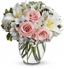 Delightful bouquet with light pink roses, white Asiatic lilies, alstroemeria, chrysanthemums, and statice arranged in a clear vase â€” approx. 10.5" x 11", all-around.