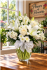 Isle of White arrangement with cream roses, white Asiatic lilies, and stock in a clear glass vase