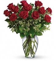 Always on My Mind bouquet with a dozen red roses and fresh greens in a spring garden glass vase